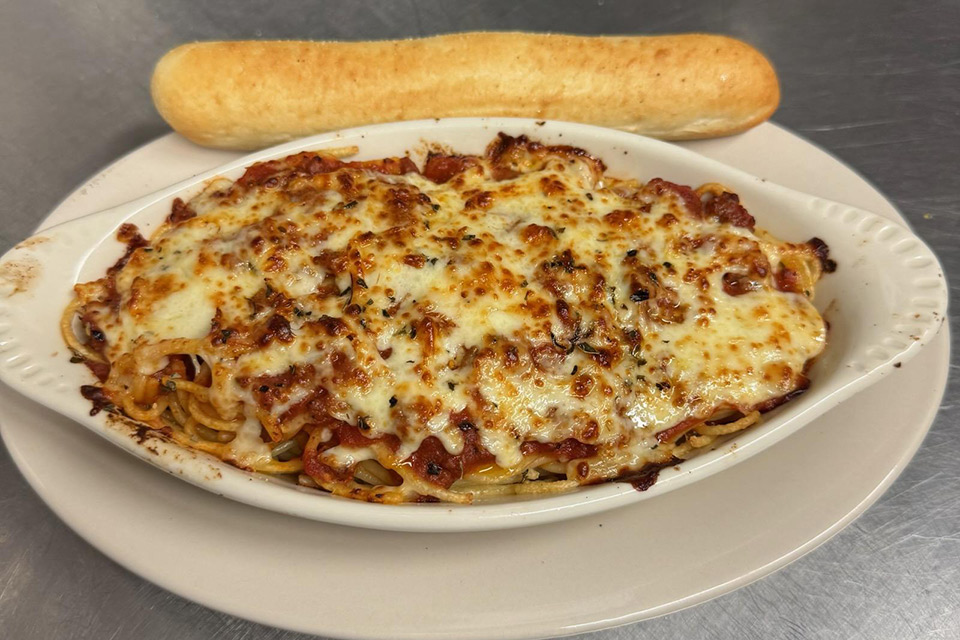 Baked spaghetti with bread stick